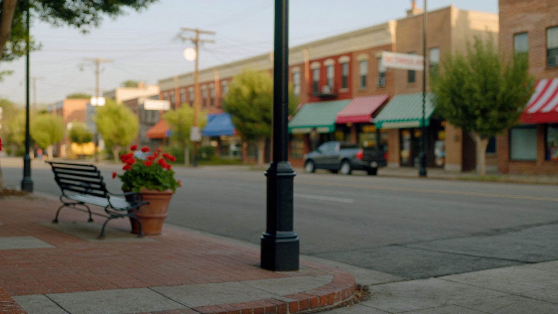 Brick storefronts on a quiet small-town Georgia main street, illustrating Roth conversion planning before RMDs for Perry, GA retirees